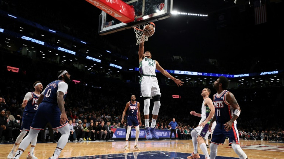 Record-setting Giannis lifts Bucks over Nets