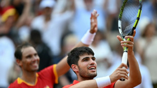 Nadal keeps Olympic flame burning, Murray back from the brink 