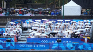 Rainy Paris Olympic parade dampens many spectators' spirits
 