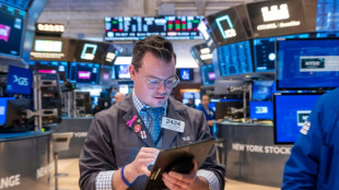 Rotation de placements à Wall Street qui termine mitigée après l'inflation américaine
