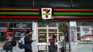 7-Eleven owner restructures to fight takeover