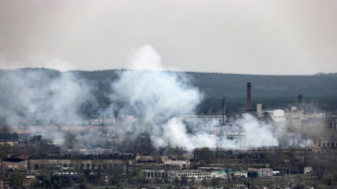 Putin honours brigade accused of atrocities as strikes hit western Ukraine
