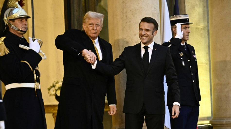 Trump says world 'a little crazy' as he meets Macron in Paris