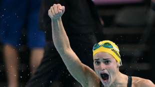 Australia's McKeown roars back to retain 100m backstroke gold