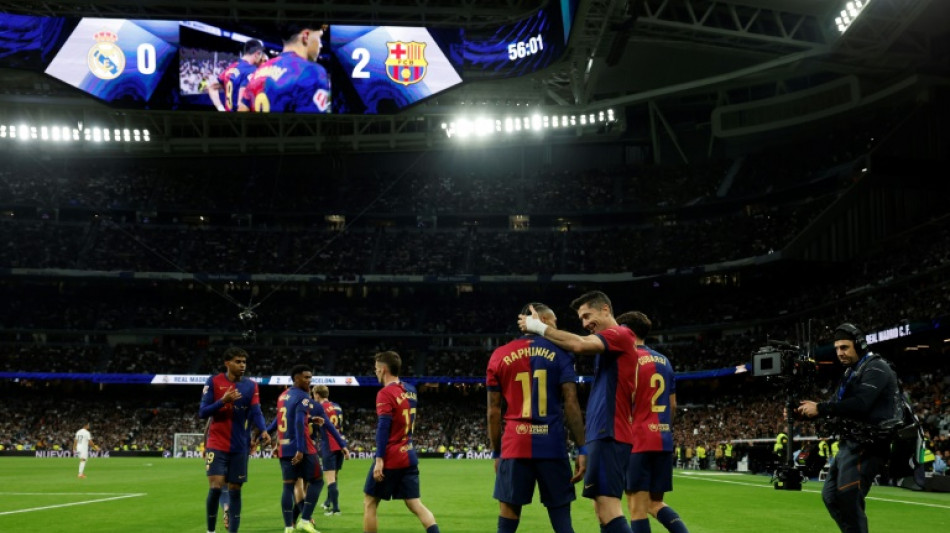 Lewandowski double as Barca shred Madrid in La Liga Clasico