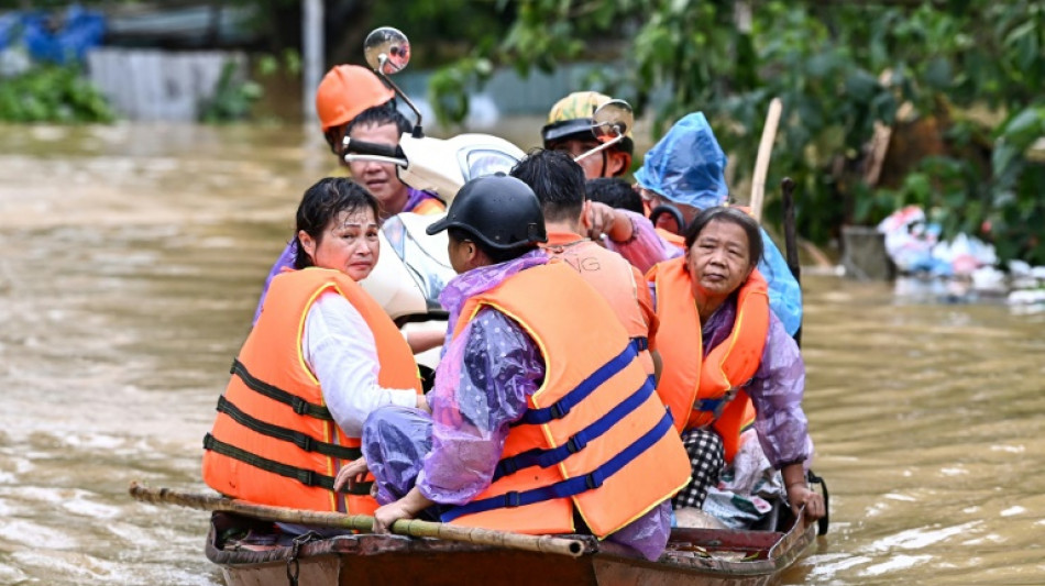 'Scared': desperate Vietnamese flee flood-hit homes