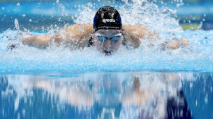 Walsh follows up 100m fly world record with Olympic berth